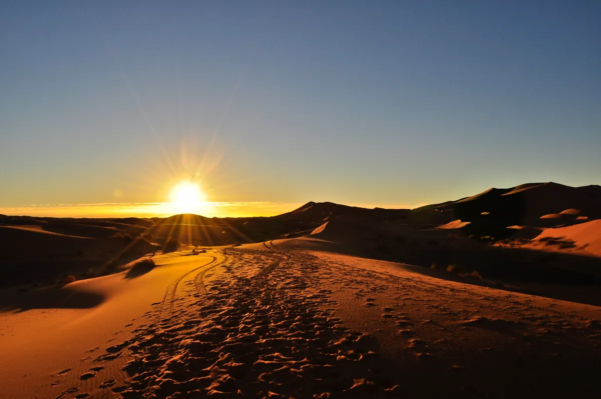 Sunrise across the golden Erg Chebbi dunes at Merzouga