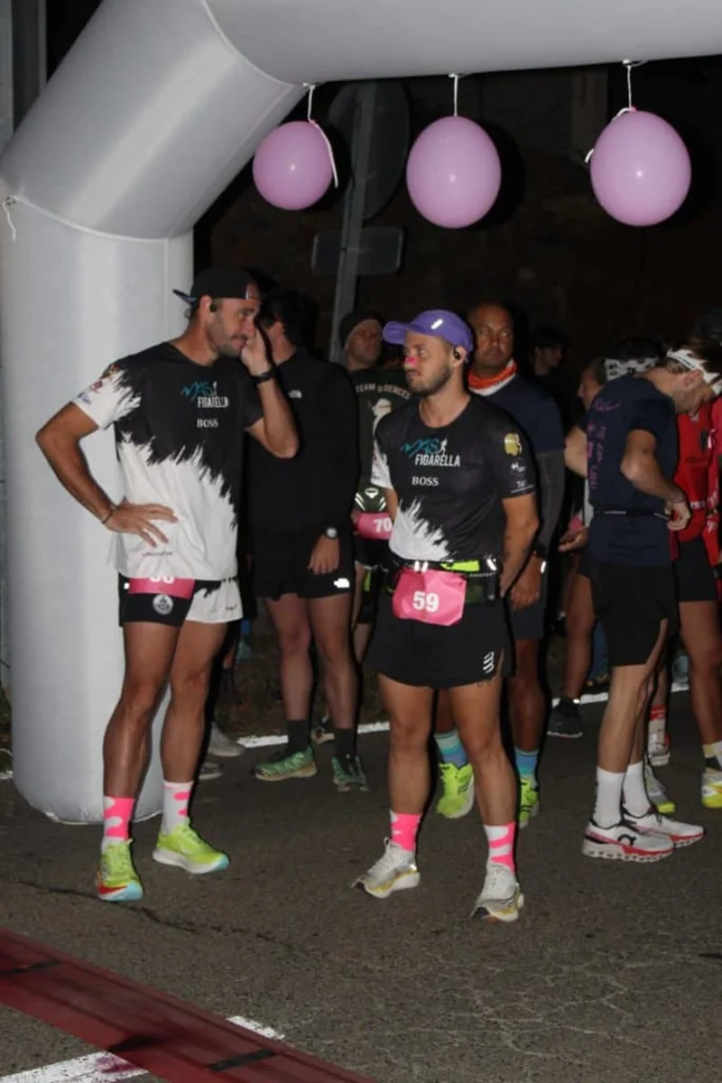 Competitors with race bibs gathered at the Ultra Trail Relay Morocco start arch, from the event’s photo gallery.