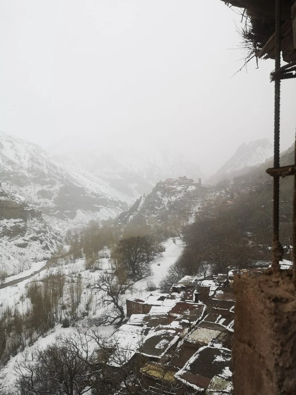 Snow-covered Ichbaken village and Tassaout Valley in winter