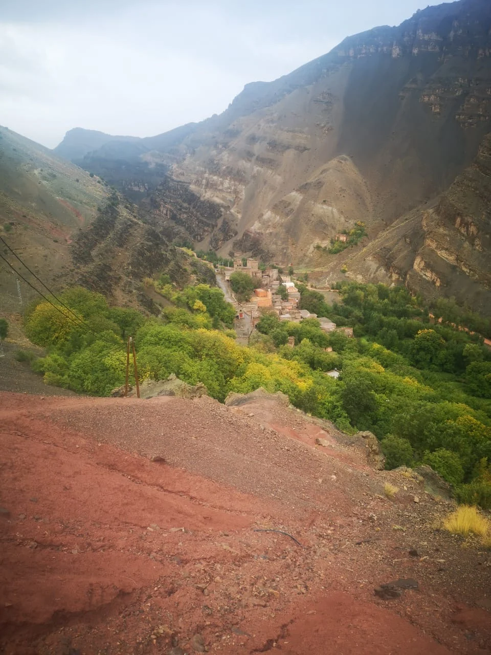 Ichbaken village beneath steep valley cliffs