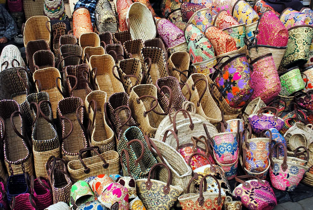 Woven baskets and decorated bags at a Moroccan market