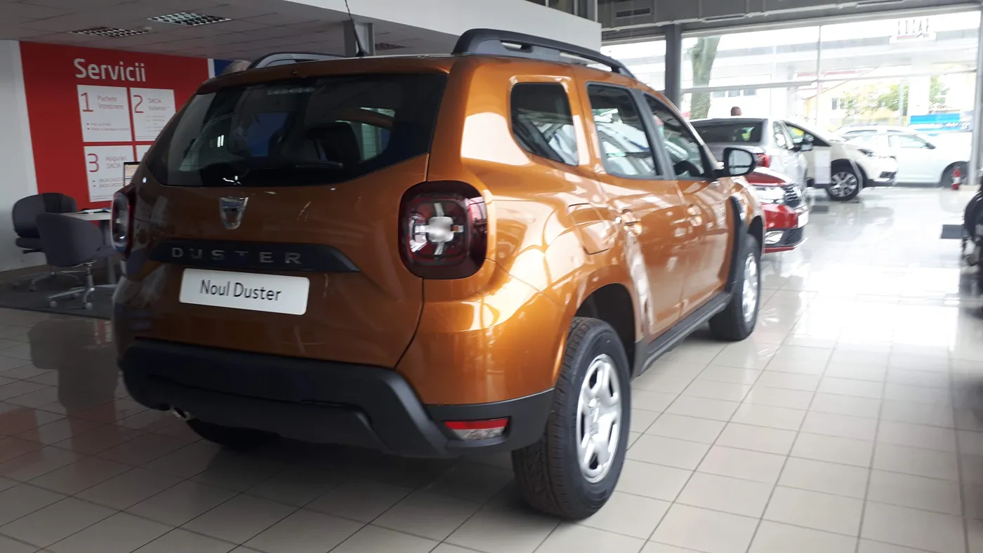 Orange Dacia Duster seen from the rear